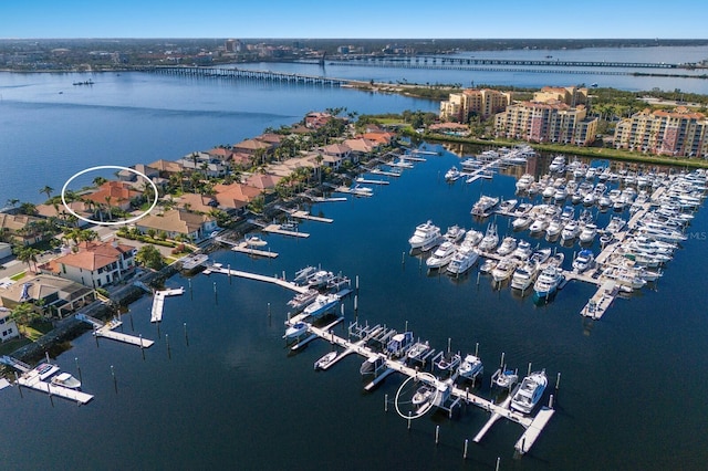 birds eye view of property with a water view