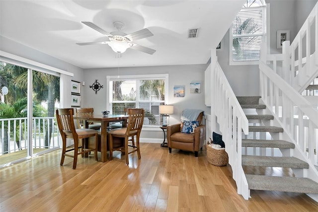 dining room with light hardwood / wood-style flooring and ceiling fan