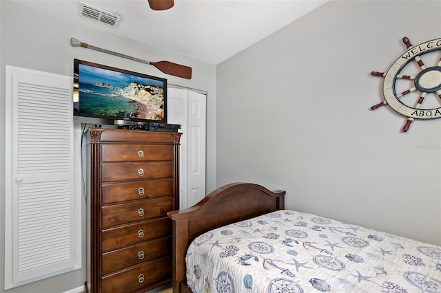 bedroom featuring ceiling fan and a closet