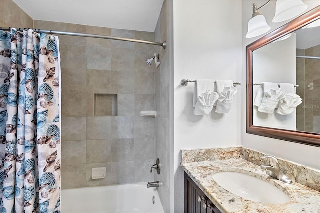 bathroom featuring vanity and shower / bathtub combination with curtain