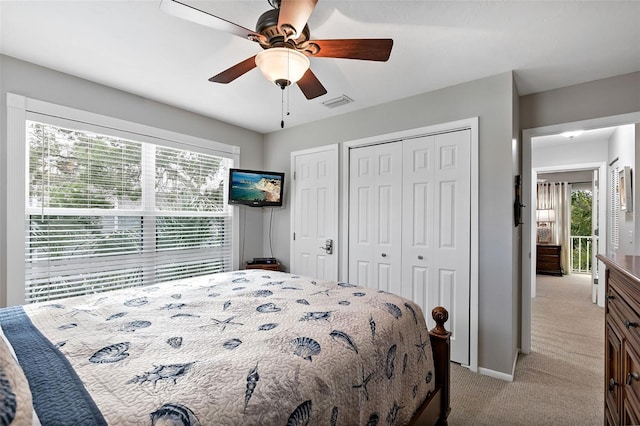 bedroom with ceiling fan and light carpet