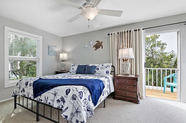 carpeted bedroom featuring access to exterior and ceiling fan