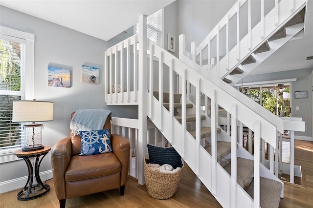 stairs with wood-type flooring