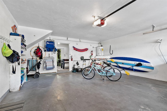 garage with water heater and a garage door opener