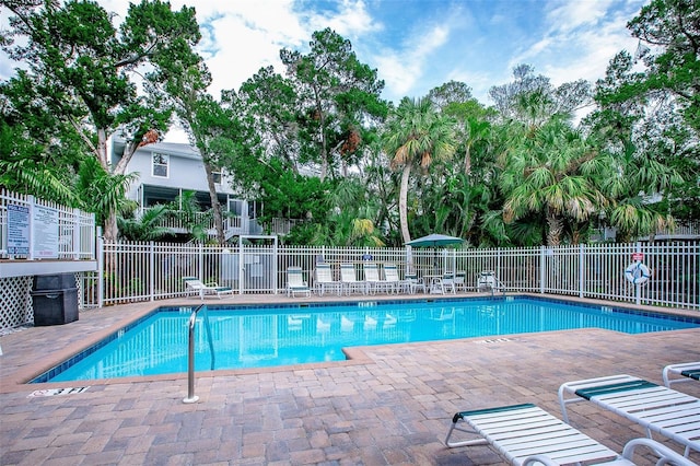 view of swimming pool with a patio area