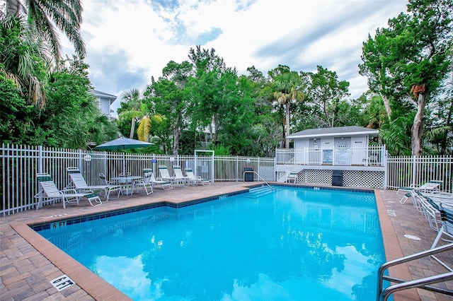 view of swimming pool with a deck