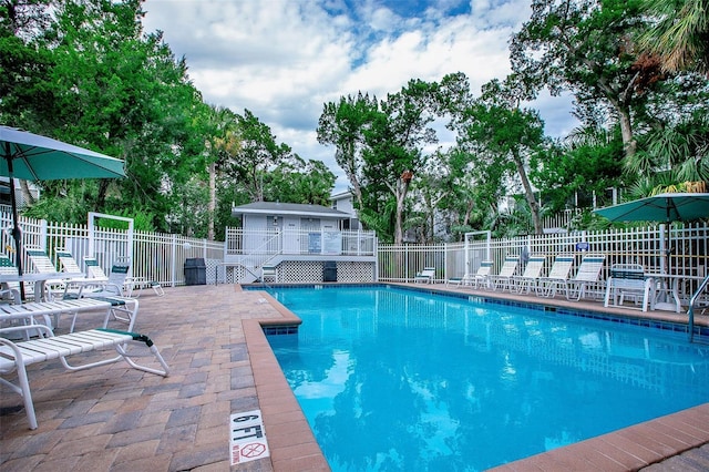 view of swimming pool featuring a deck