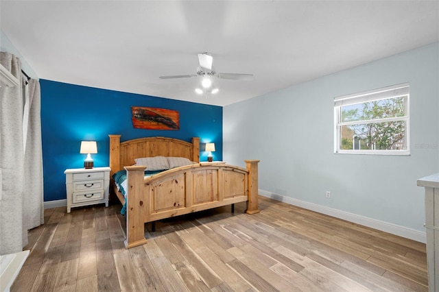 bedroom featuring light wood-type flooring and ceiling fan