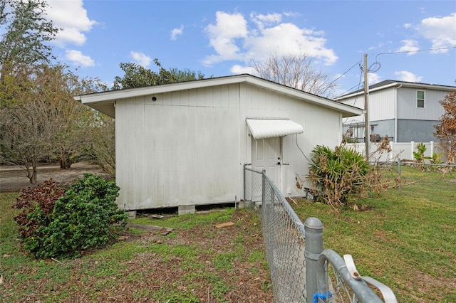 view of side of property with a lawn