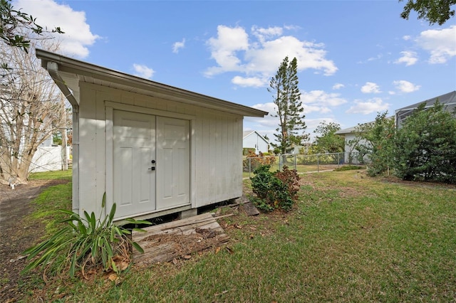 view of outdoor structure with a yard