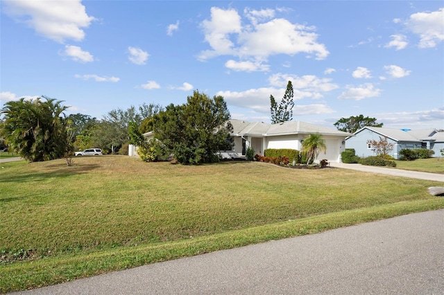 view of front of house featuring a garage and a front yard