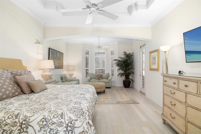 bedroom featuring ceiling fan, light wood-type flooring, and ornamental molding