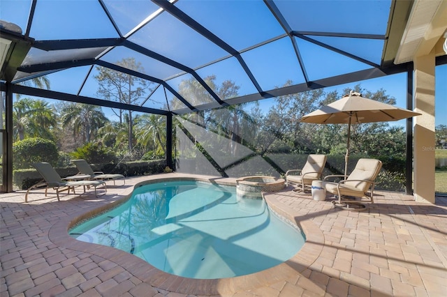 view of pool with an in ground hot tub, a patio area, and a lanai