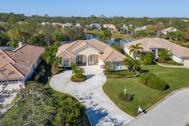 birds eye view of property with a residential view and a water view