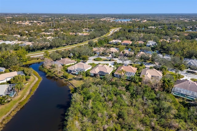 birds eye view of property featuring a residential view and a water view