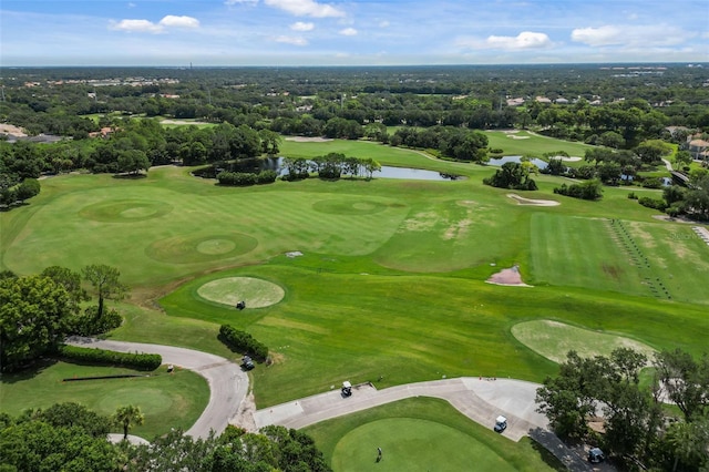 birds eye view of property featuring a water view and view of golf course