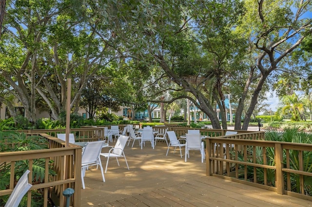 wooden terrace featuring outdoor dining space