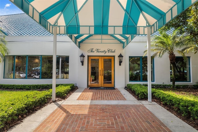 entrance to property featuring french doors