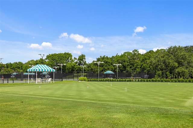 view of property's community with fence