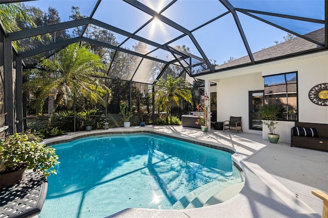 outdoor pool featuring a lanai and a patio area