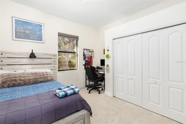 bedroom with light colored carpet and a closet