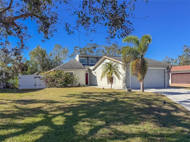 view of front of home featuring a garage and a front lawn