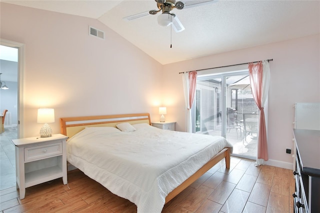 bedroom featuring ceiling fan, lofted ceiling, and access to outside