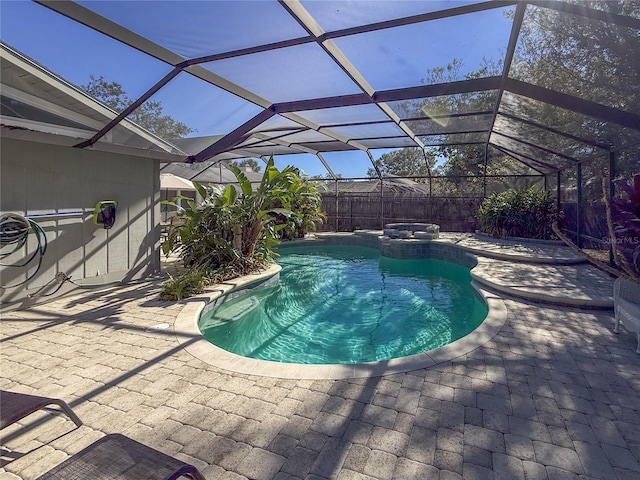 view of pool with a lanai and a patio area