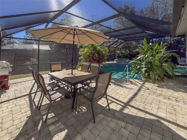 view of patio featuring a swimming pool with hot tub and glass enclosure