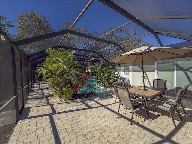 view of patio / terrace featuring a lanai