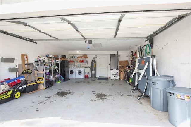 garage featuring separate washer and dryer, a garage door opener, and water heater