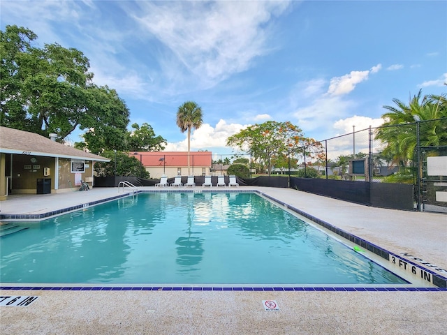 view of swimming pool featuring a patio