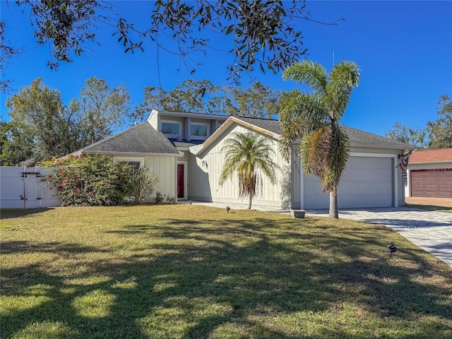 view of front facade with a garage and a front lawn