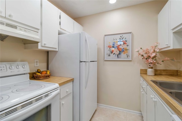 kitchen featuring white appliances, white cabinets, ventilation hood, sink, and light tile patterned floors