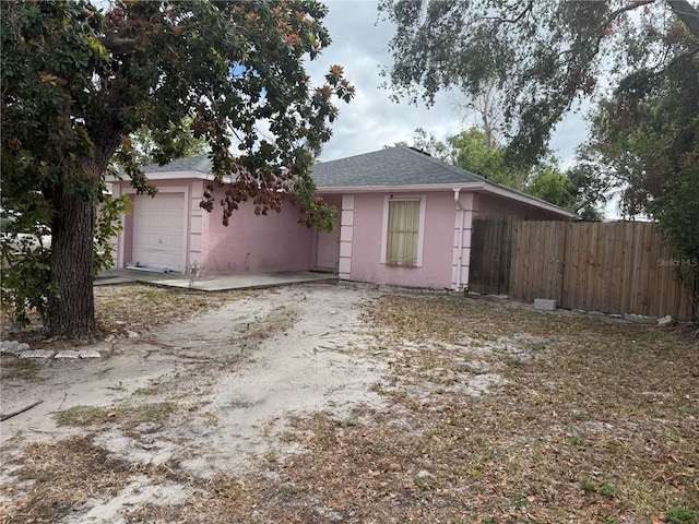 single story home with a garage