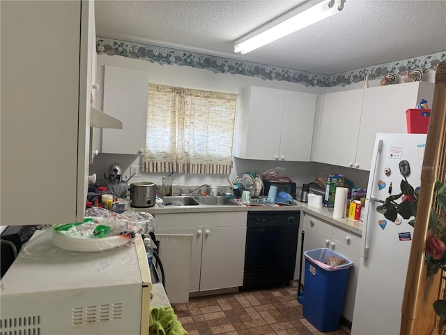 kitchen with white refrigerator, sink, a textured ceiling, black dishwasher, and white cabinetry