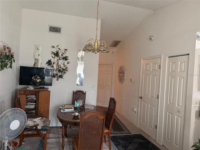 dining space featuring a notable chandelier and lofted ceiling