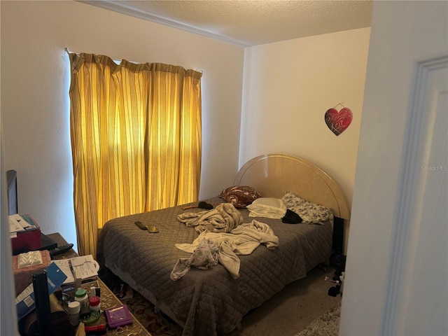 carpeted bedroom with a textured ceiling