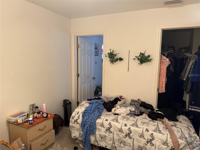 bedroom featuring a closet and carpet