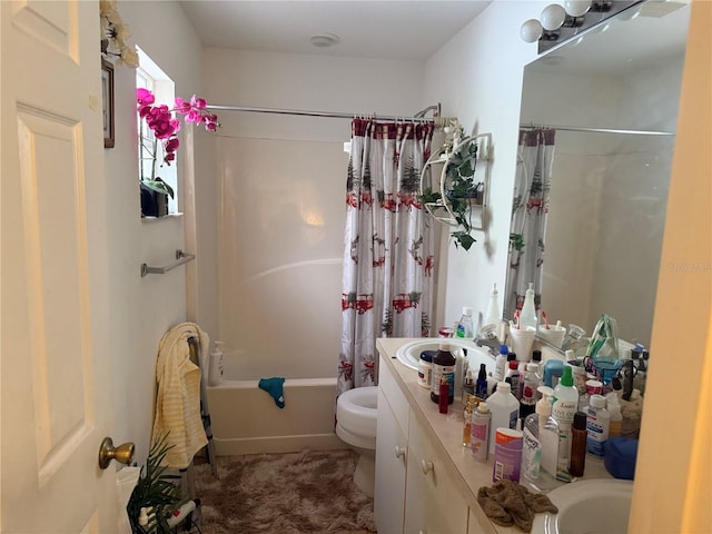 full bathroom with vanity, toilet, and shower / tub combo