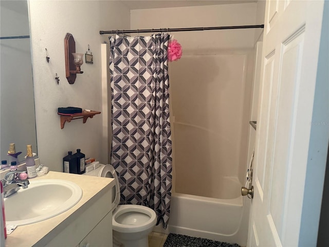 full bathroom featuring vanity, shower / bathtub combination with curtain, and toilet