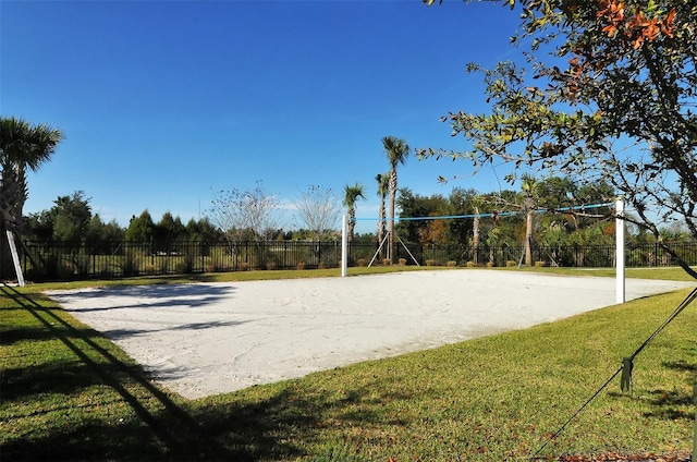 surrounding community with volleyball court and a yard