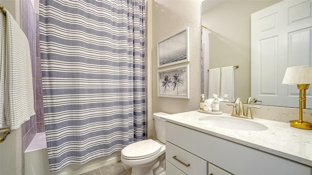 bathroom with toilet and vanity