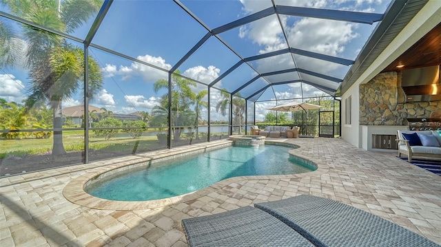 view of swimming pool with a lanai, an outdoor kitchen, outdoor lounge area, a patio area, and grilling area