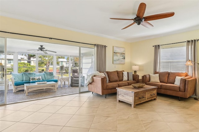 tiled living room with crown molding and ceiling fan