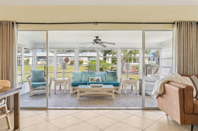 sunroom / solarium featuring ceiling fan