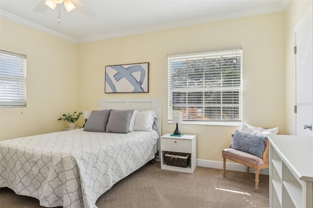 bedroom featuring multiple windows, crown molding, carpet floors, and ceiling fan