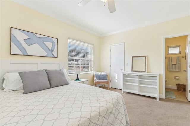 carpeted bedroom featuring ornamental molding and ceiling fan