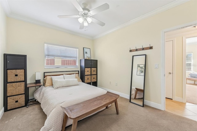 bedroom with multiple windows, crown molding, light carpet, and ceiling fan