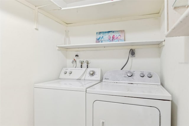 clothes washing area featuring washer and dryer